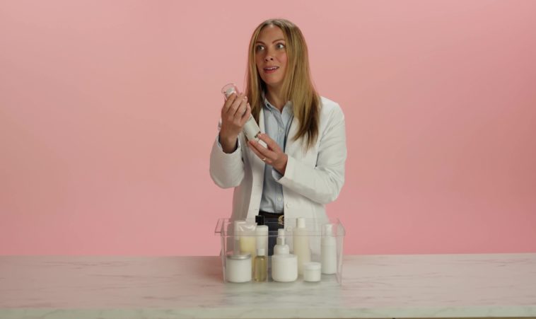 Woman holding skin care products